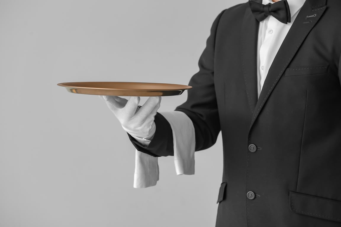 Waiter Holding a Copper Tray